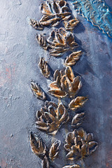 Flower molding in gray gold tones