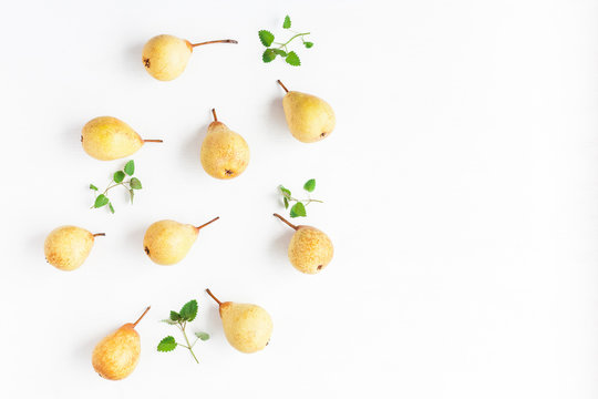 Fresh pears on white background. Flat lay, top view, copy space
