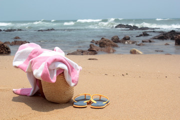 Towel,beach bag and slipper in beach