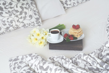 Breakfast in bed coffee, waffles, strawberry
