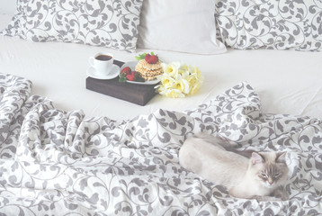 Breakfast in bed coffee, waffles, strawberry