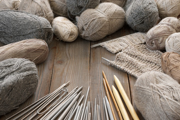 Various neutral colored yarn and needles