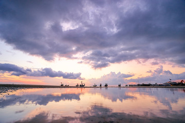 Fototapeta na wymiar Beautiful tropical sunset. Seascape with purple sky and longtail boats. Samui Island, Thailnd.