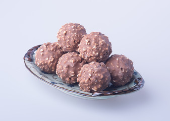 chocolate ball or chocolate bonbon on a background.