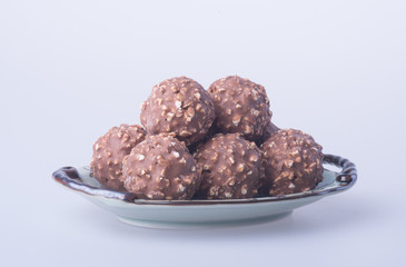 chocolate ball or chocolate bonbon on a background.