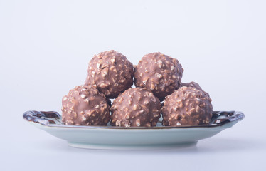 chocolate ball or chocolate bonbon on a background.