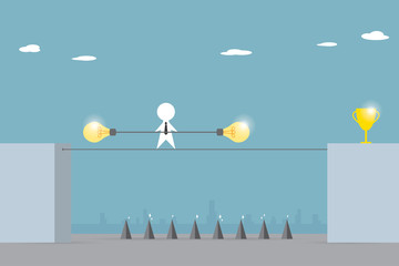 businessman balancing on the rope with lightbulb stick to pass the trap to golden trophy