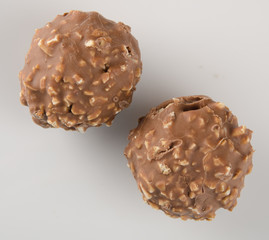 chocolate ball or chocolate bonbon on a background.