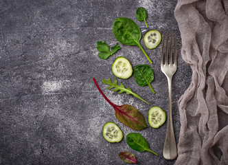 Sliced cucumber and salad mix.