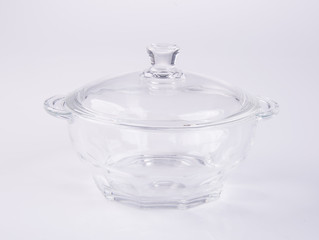 glass pot or glass casserole with lid for baking on a background.