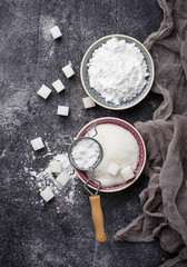 Sugar and powder on concrete background