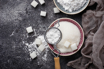 Sugar and powder on concrete background