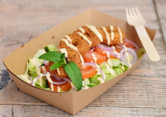 Close up of take away bowl with fast food  chicken salad