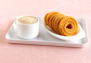 Chakli, also known as murukku, which is a south Indian traditional, popular and vegetarian snack, is made from deep-frying portions of chickpea flour dough, and coffee.