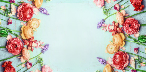 Pretty floral banner with various colorful garden flowers on blue turquoise shabby chic background, top view