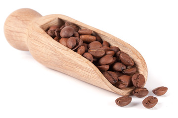 coffee beans in a wooden scoop isolated on white background