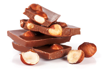 Chocolate with hazelnuts isolated on white background