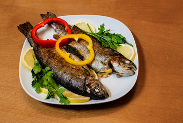 Two baked trouts