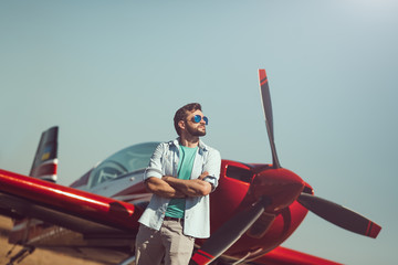 Man in front of vintage plane