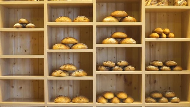 Modern bakery with different kinds of bread, cakes and buns