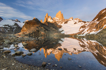 Fitz Roy mountain and lake at red sunrise