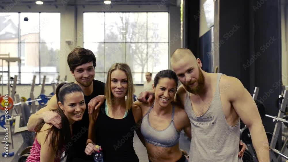 Canvas Prints Young people in crossfit gym posing for photo after work out.