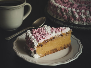 Cake with a beautiful decoration of cream (pink and white) 