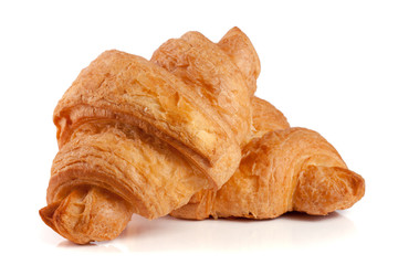 two croissant isolated over a white background closeup