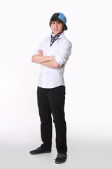 Handsome student confidence. Studio full length portrait of young man in american bandana and cap with hands crossed Isolated on white background.