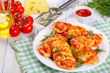 Chicken breasts coated with melted cheese