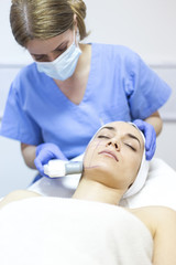 Cosmetic treatments for the skin in the beauty salon. Woman in spa salon