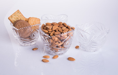 Almond or Almond in jar on the background.