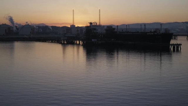 LNG carrier alongside jetty in pertochemical port