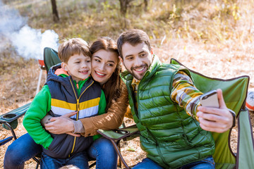 Happy family taking selfie