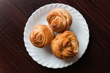 Fresh bread rolls on a white plate