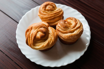 Fresh bread rolls on a white plate