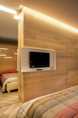 wooden TV wall with mirror and door incorporated
