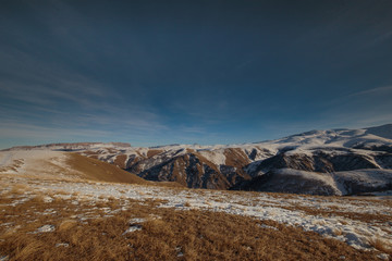 Russia. The formation and movement of clouds above the volcano Elbrus in the Caucasus Mountains in winter.