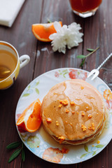 Pancakes with green tea with flowers