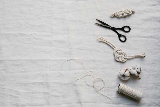White table top wit yarn and scissors