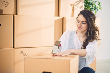 Woman moving in a new apartment