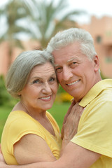 Happy elderly couple embracing