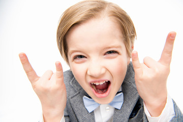 Boy showing rock sigh