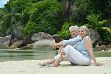 Elderly couple rest at tropical resort
