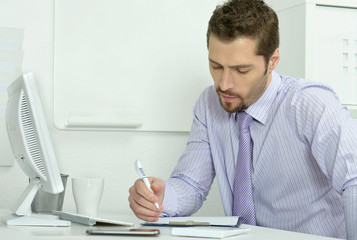 Businessman at the desk working 