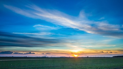 Beautiful vibrant sky over fields in Poland