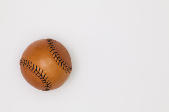 Leather baseball ball on the white table.