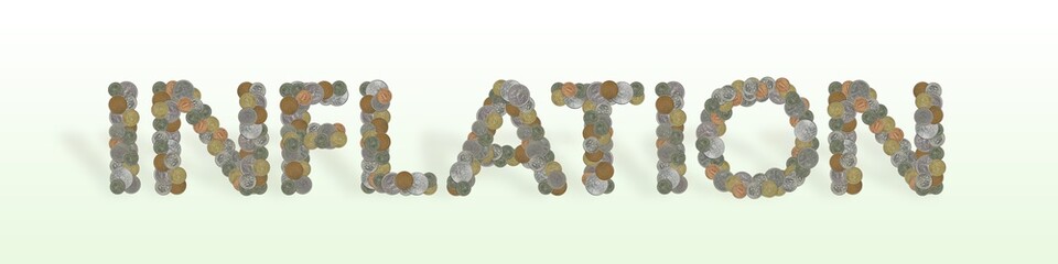 INFLATION – Coins on green background