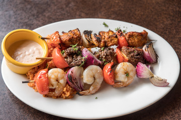 beef , fork and shrimp Barbecue with source 