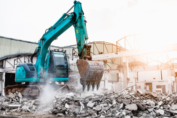 Excavators machine in construction site demolishing existing building